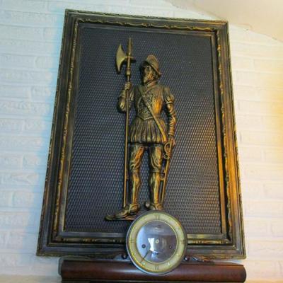 Tin wall plaque of conquistador 