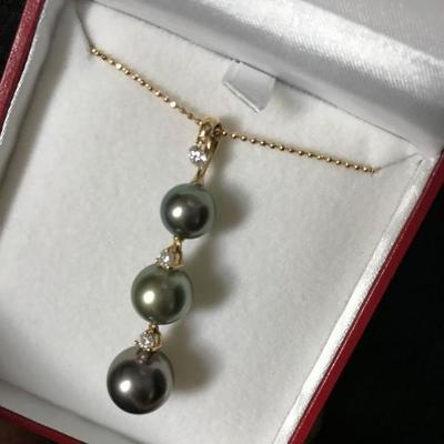 8 x 11 mm Tahitian cultured pearl necklace set in 18k gold with 0.33 ct of diamonds. $2,895