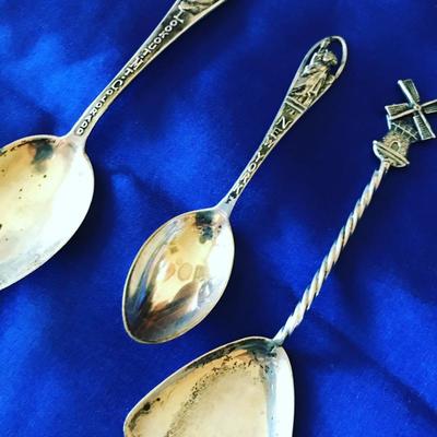 Over 25 sterling silver souvenir spoons from Europe, Canada and U.S.