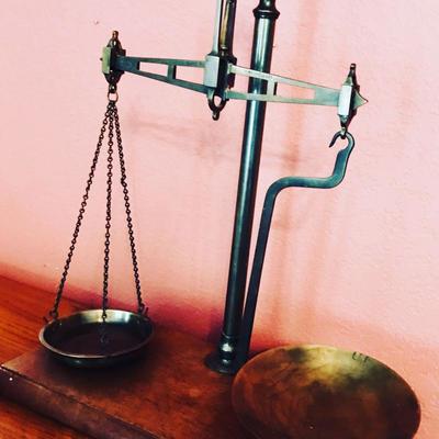 Brass and mahogany wood balance scale with weights @ $150. 