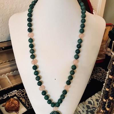 Vintage adventurine and rose quartz pendant necklace. 26 inches long with silver clasp. Pendant carved on both sides. $295