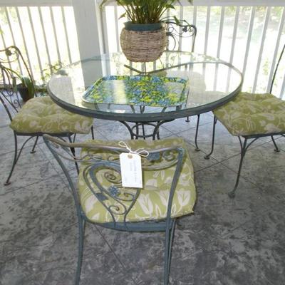 Round glass and metal table and set of 4 chairs $250
table 42 X 29"
