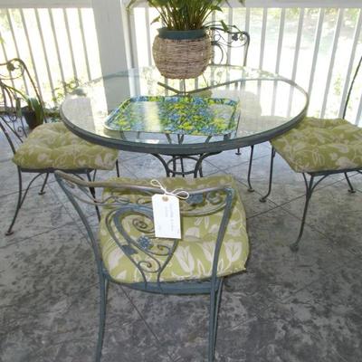 Round glass and metal table and set of 4 chairs $250
table 42 X 29