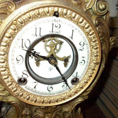 Gilded mantle clock $900