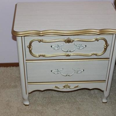 White and gold (colored) night stand, two drawers.