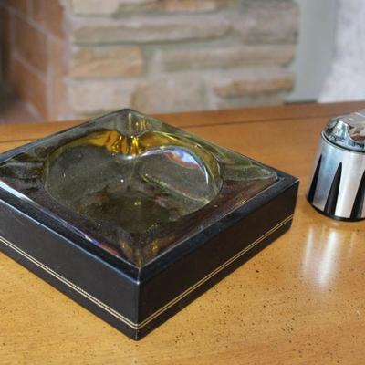 Elegant vintage ash trays and lighters.