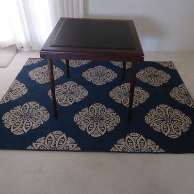 Elegant card table and rug