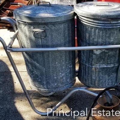 Galvanized trash can with their own cart on wheels! 