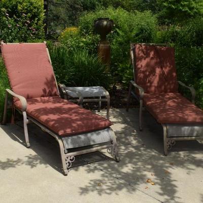 Patio chaise lounge chairs and small table