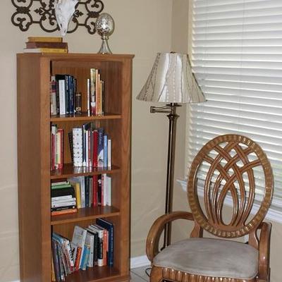 View of Oak Bookcase, Floor Lamp and Balloon Back Chair shown with a Sika Antlered Skull Mounted on Decorative Wrought Iron