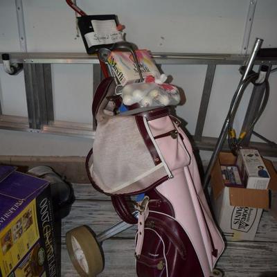 Golf bag, some clubs, balls