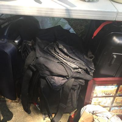 Lots of suitcases and carrying bags.