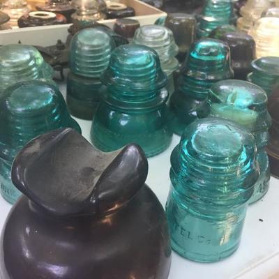 Tons of glass and ceramic phone insulators.