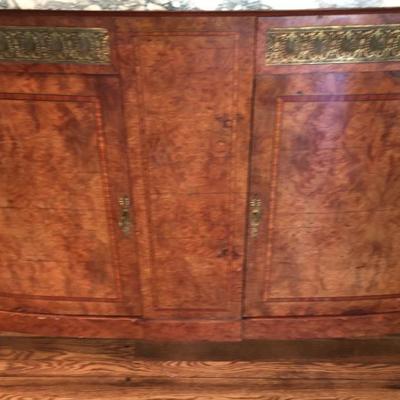 Sideboard with marble top and mirror.  In great condition with a Tigerwood finish.  Available for presale $600