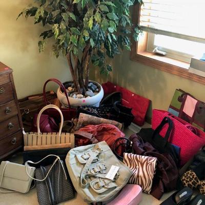 Lots of purses, several with tags still on
