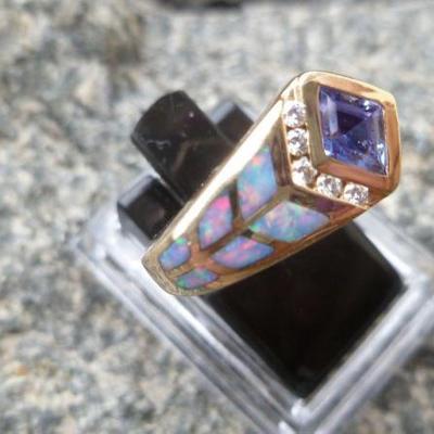 Kabana tanzanite and black opal inlaid iamond ring.
