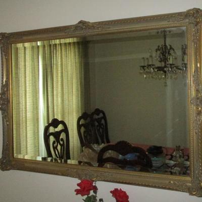 Beveled mirror with gold tone frame