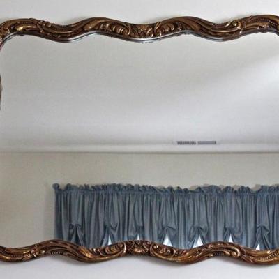 large mirror in gold frame