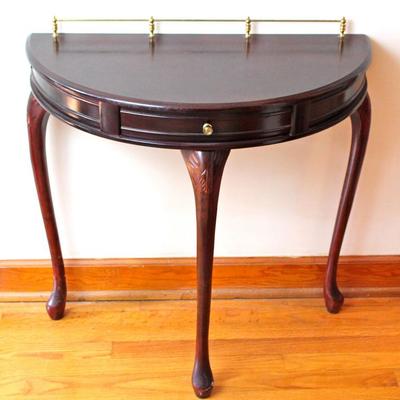 demilune table with brass rail