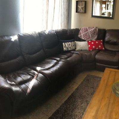 BEAYTIFUL ALL LEATHER COUCH WITH ELECTRIC RECLINER.  9' AT THE CURVE WITH A 5' EXTENSION.  CUSTOM BUILT.