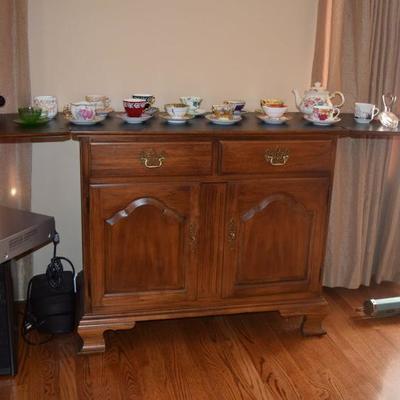 Sideboard, teacups and saucers, electronics