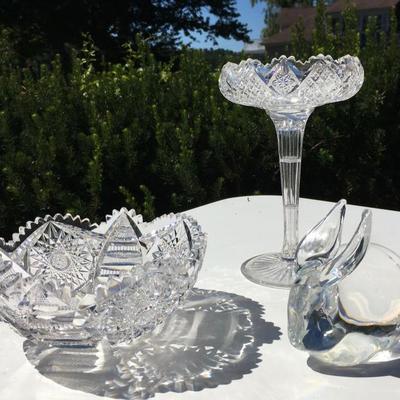 Many crystal pieces, some with minor dings, including a Libby bowl and Steuben glass rabbit. 