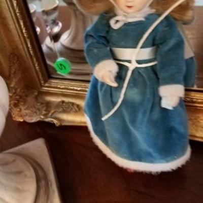 Ceramic doll in velvet