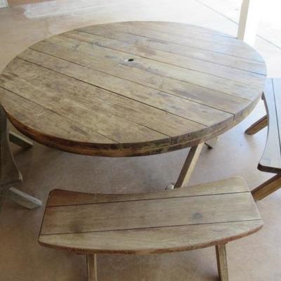 Circular picnic table with benches