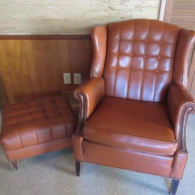 Vintage faux leather (vinyl) upholstered easy chair with ottoman