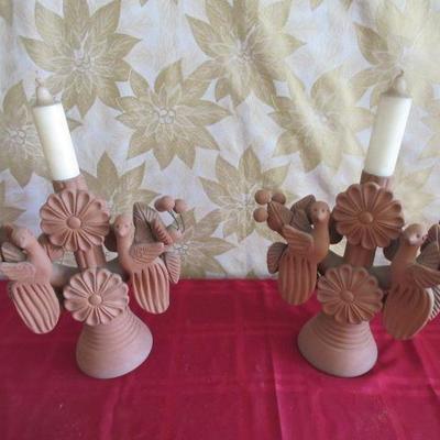 Vintage candle stick holders made with clay and other pottery materials, very ornate and unique