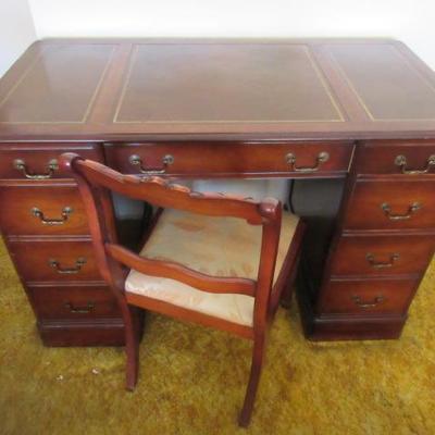Vintage mahogany with leather insets on top executive desk
