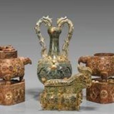Four carved stone and inlaid shell vessels: pair of round censers atop a plinth, one with cover; gong together with amphora vase with...