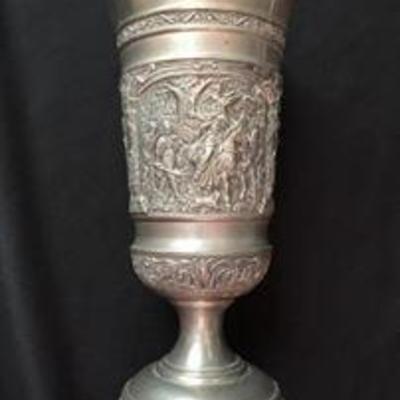 Antique silver chalice with an engraved scene