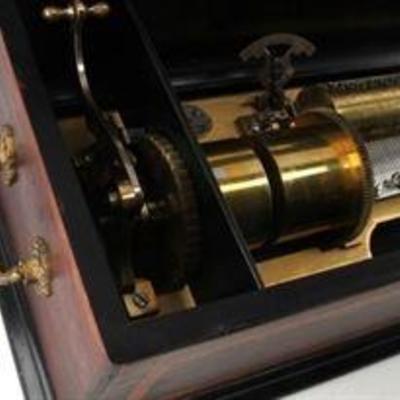 Music box first patented in the US on March 1st, 1881 which appears to play 8 separate songs. Does not have identifying sheets stating...