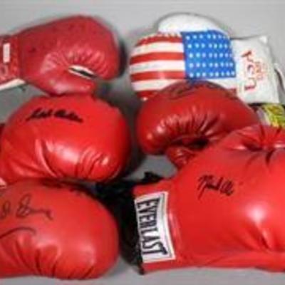 Large collection of signed boxing gloves