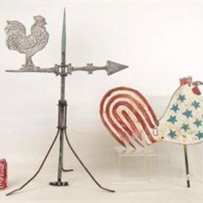 Metal folk art roosters attached to a weather vain.