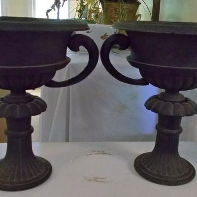 Caste iron urn $125 each
2 available
