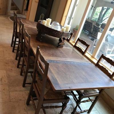 Mexican rustic dining table with 11 chairs. $875 (all chairs not pictured in photo)