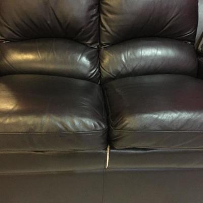 4 seat leather sectional sofa w/2 consoles (has small tear).