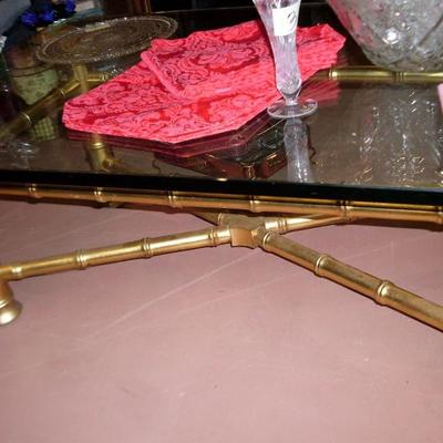 GOLD AND HEAVY GLASS COFFEE TABLE