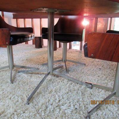 Rosewood table and 4 chairs all are made of Rosewood all on chrome bases with original tagsÂ from 1963 purchased at Marchall Fields. RARE...