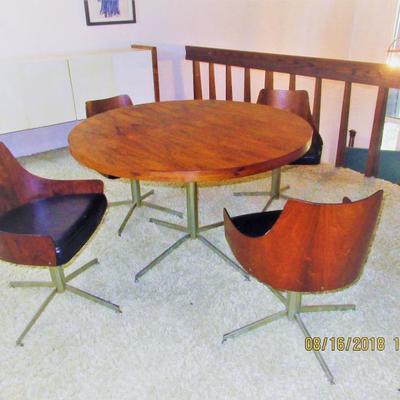 Rosewood table and 4 chairs all are made of Rosewood all on chrome bases with original tagsÂ from 1963 purchased at Marchall Fields. RARE...