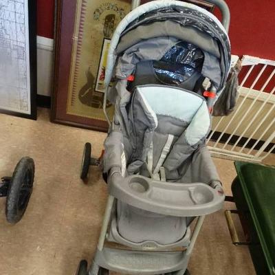 Baby stroller and a graco boster seat.