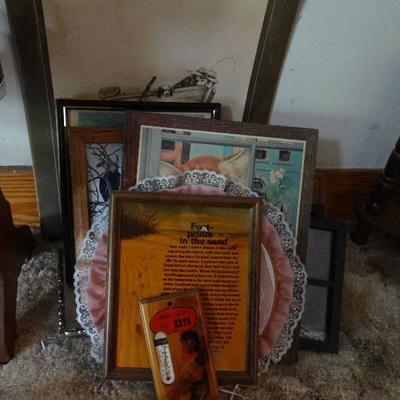 Lot of framed pictures.