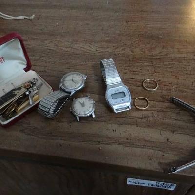 3 watches , pins and clips.