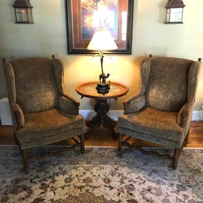 Pair of American Signature paisley print high back wing chairs.