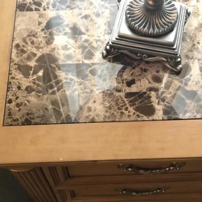Inlaid marble top of nightstand