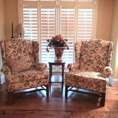 Pair of floral vintage high back wing chairs (maker unknown).