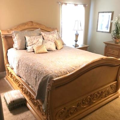 Bedroom set includes queen bed frame, 2 nightstands, dresser, mirror and storage armoire.