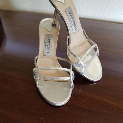Jimmy Choo. Silver metalic Slip-on heels. Size 7.5. Used once. Retails for $450. Estate sale price: $200.
